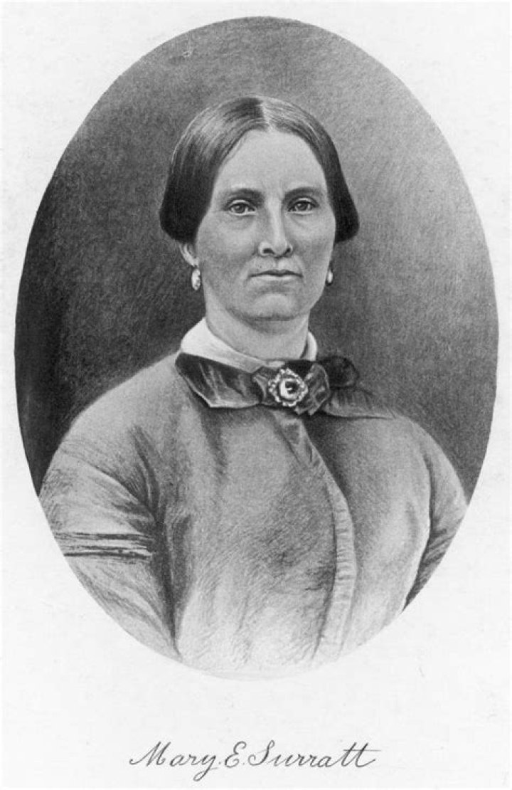 Why did booth visit Mary Surratt?